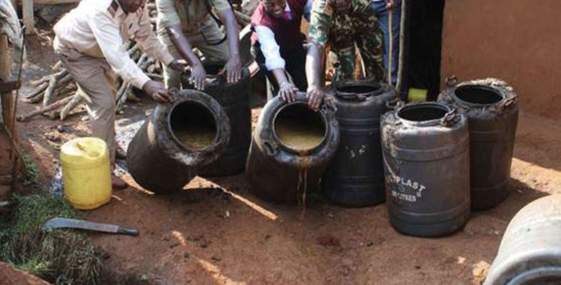 NACADA officers and police destroy brewing equipment during a pre-dawn raid in Soweto village, Kahawa West. (Photo credit)